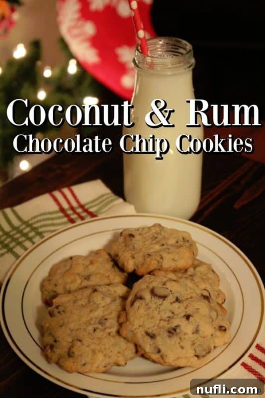 Tropical Chocolate Chip Coconut Rum Cookies 2 Warm Chocolate Chip Coconut Rum Cookies piled on a white plate next to a glass of milk, with blurred festive lights in the background, evoking a cozy yet exotic holiday feel.