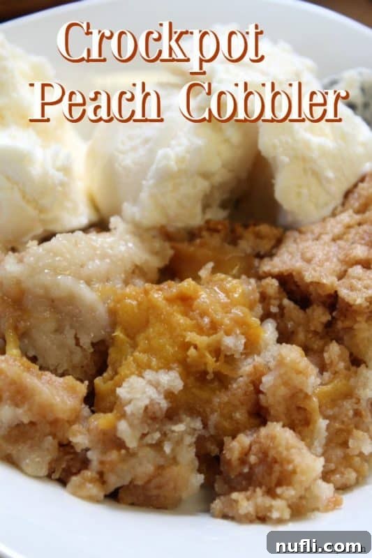 Delicious Slow Cooker Peach Cobbler with a scoop of vanilla ice cream, ready to be enjoyed