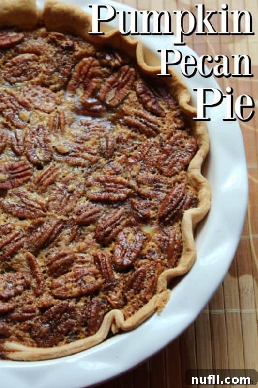 A stunning Pumpkin Pecan Pie in a white pie dish, ready to be served