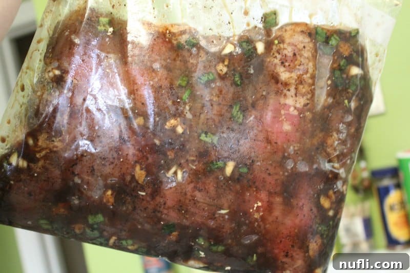 Asian flank steak marinating in a Ziploc bag