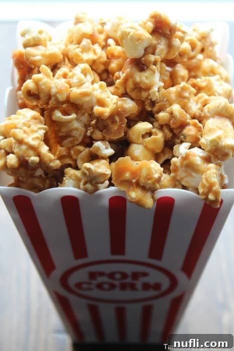 sriracha caramel corn in a popcorn container
