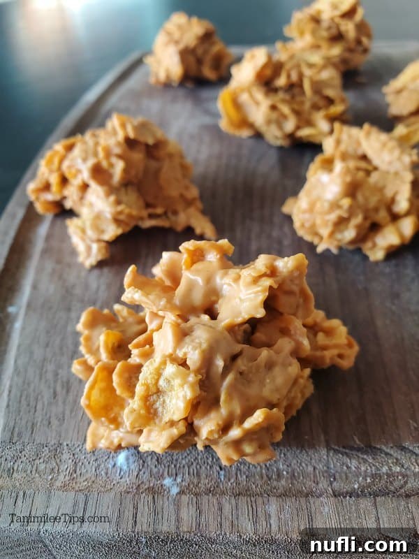 A cluster of butterscotch cornflake cookies presented beautifully on a cutting board, ready for serving.