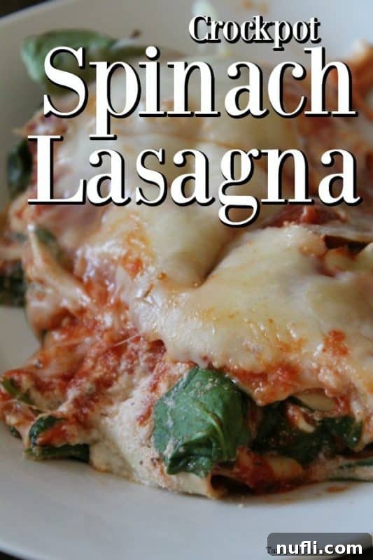 Close-up of a delicious Crockpot Spinach Lasagna on a white plate, showcasing cheesy layers and vibrant spinach.