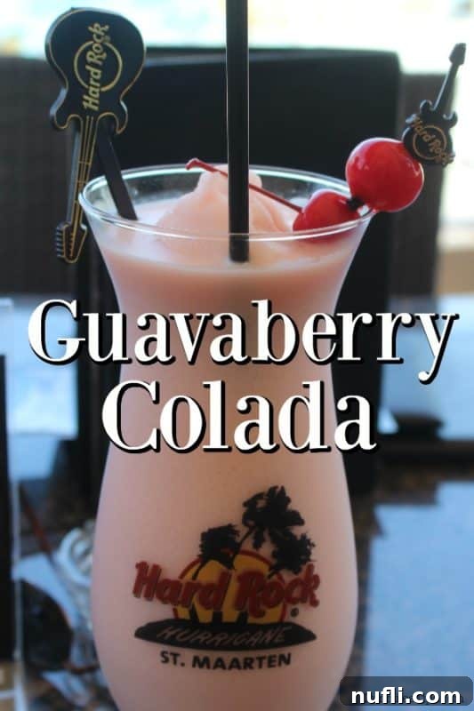 Guavaberry Colada in a hard rock hurricane glass, perfect for a tropical escape