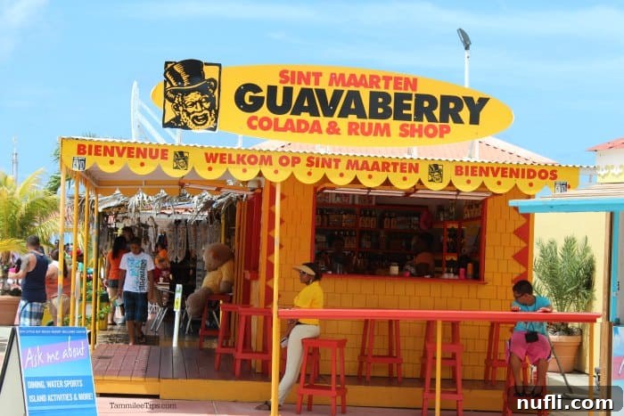 Sint Marten Guavaberry Colada and Rum Shop yellow stand, inviting visitors to taste local flavors