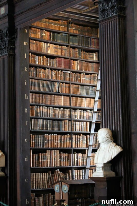 Shelves of historic books in the Trinity College library