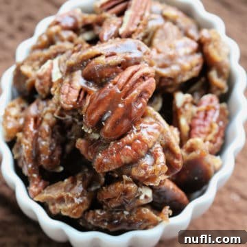 Guinness glazed pecans in a white bowl