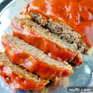 Effortless Slow Cooker Meatloaf 5 crockpot meatloaf sliced on a silver platter
