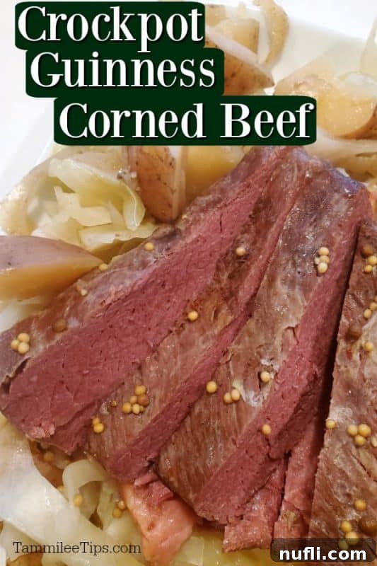 crockpot guinness corned beef and cabbage on a white plate