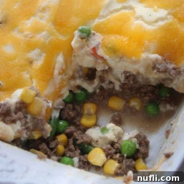 Shepherds pie in a white baking dish, prepared for serving.