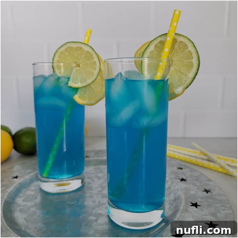 Sun-Kissed Sips: Over 35 Refreshing Summer Cocktails 30 Blue Electric Lemonade in tall glasses with lemon and lime wheels and yellow paper straw