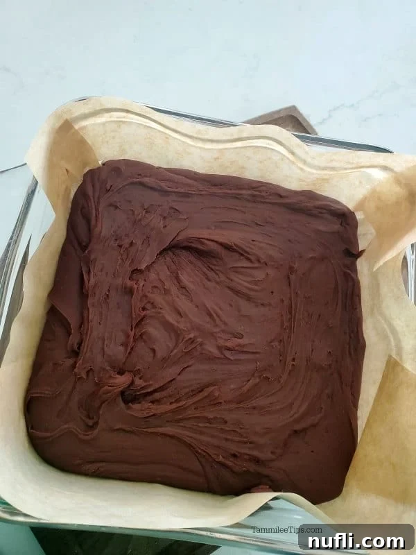 Carnation Famous chocolate fudge set in a parchment-lined baking dish