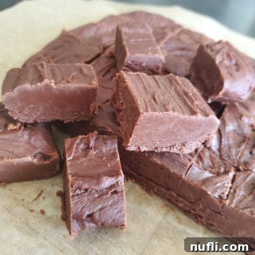 Famous Carnation Fudge stacked on parchment paper