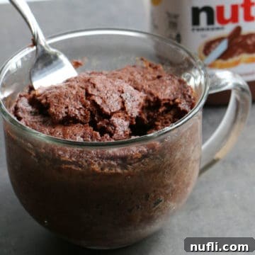 Nutella Mug Cake with a fork in a glass mug