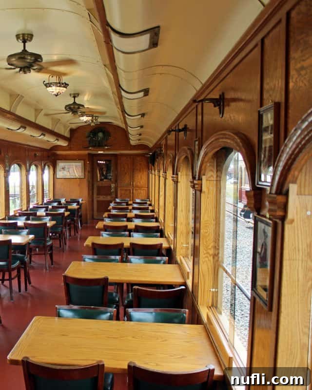 Napa Valley Wine Train Experiences 13 Interior of the Silverado Car on the Napa Valley Wine Train, set with tables and chairs