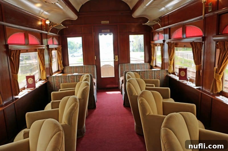 Napa Valley Wine Train interior with comfortable chairs in a row looking out to the windows