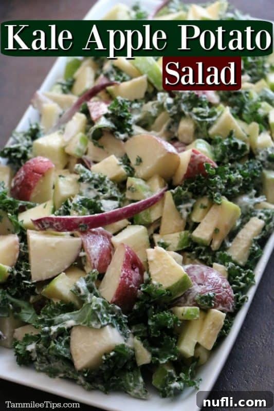 A beautifully presented Kale and Apple Potato Salad on a white platter, ready to serve.