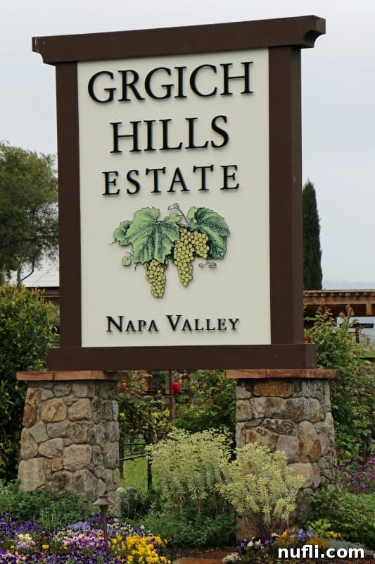 Grgich Hills Estate Napa Valley sign with flowers below it