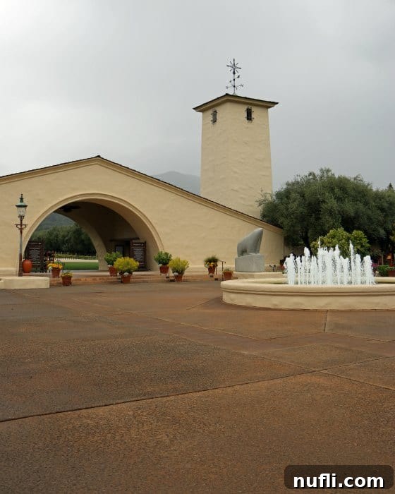 Exterior of Robert Mondavi Winery with a fountain 