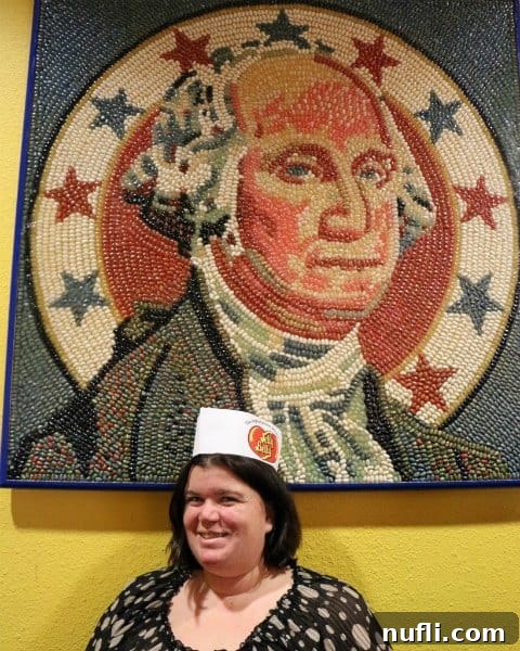Tammilee under a portrait of George Washington made with Jelly Bellys