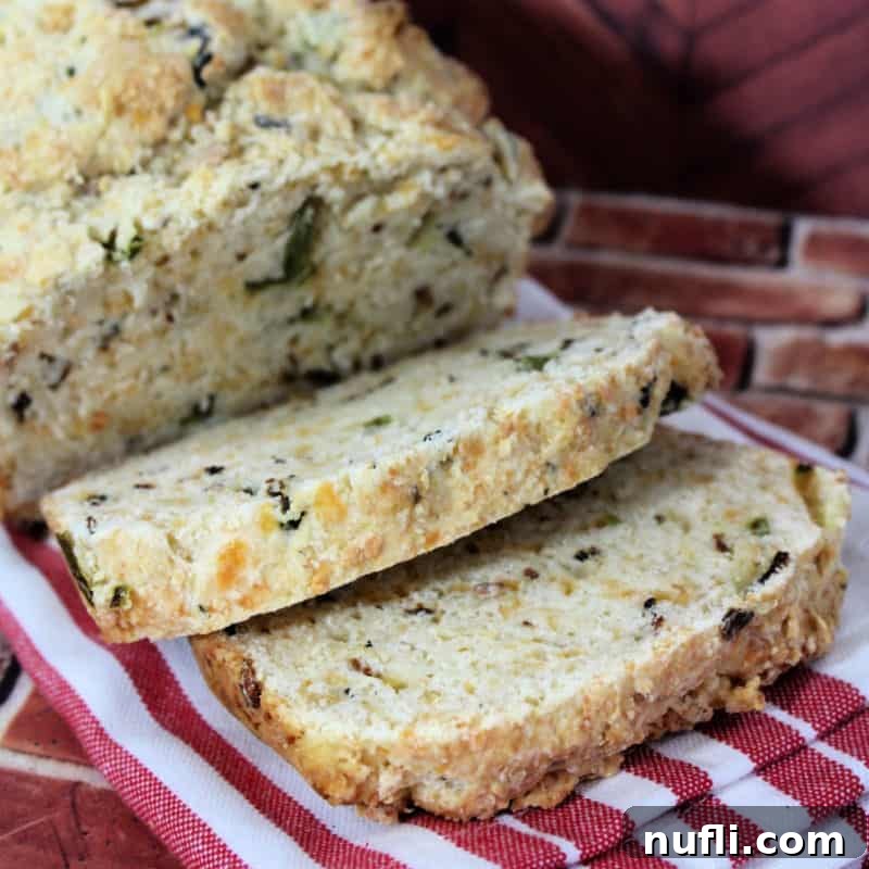 slices of bacon jalapeno bread on a red white striped napkin