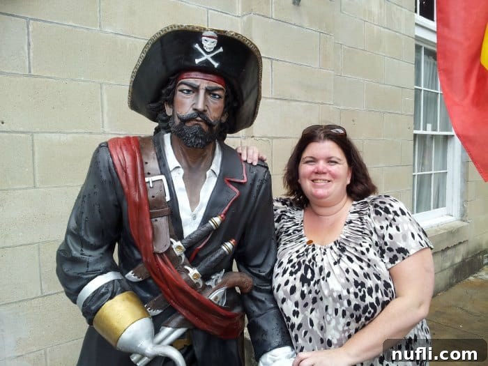 Visitor posing next to a pirate statue outside Mel Fisher Maritime Museum in Key West