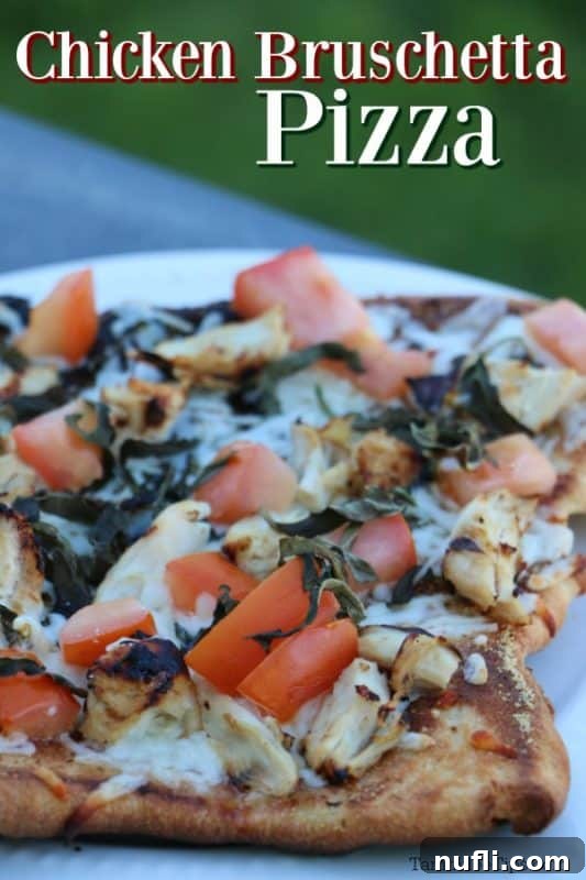 Chicken bruschetta pizza on a white plate, ready to be served