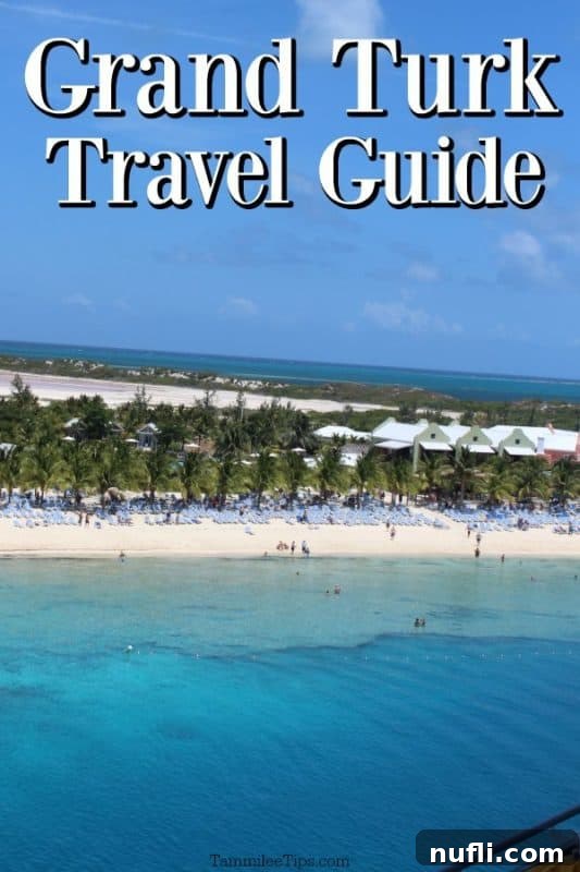 Grand Turk Travel Guide over tropical beach with lounge chairs lined up and palm trees