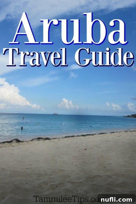 Aruba travel guide featuring a pristine beach with turquoise water and blue sky