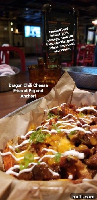 Crispy dragon chili cheese fries served in a basket, a perfect snack after a swim