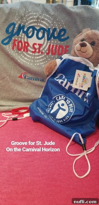 A 'Groove for St. Jude' t-shirt, a tote bag, and a teddy bear, representing a charitable initiative on Carnival cruises