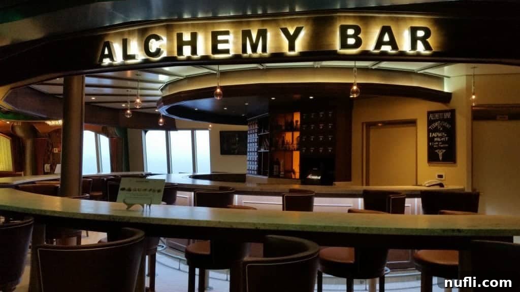 Alchemy Bar interior on Carnival Freedom with mixologists at work