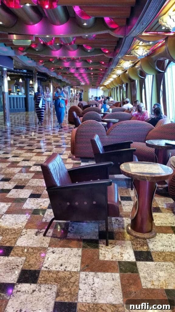 Elegant staircase and atrium on Carnival Freedom