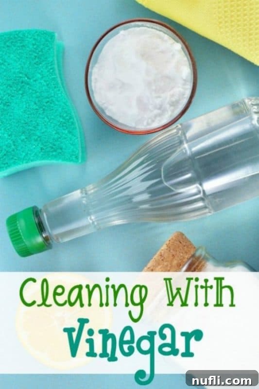 Cleaning wiht vinegar next to a bottle of vinegar and baking soda