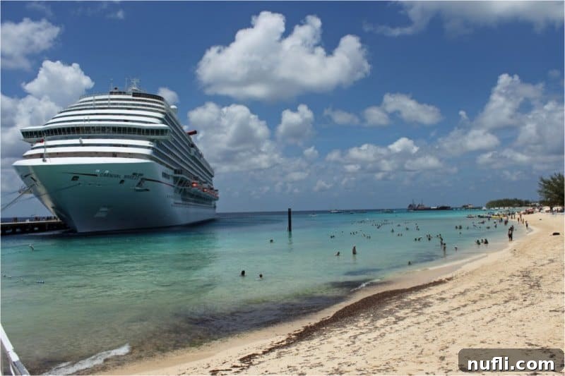 Carnival Cruise ship docked in Grand Turk, showcasing the vibrant cruise terminal and pristine waters.