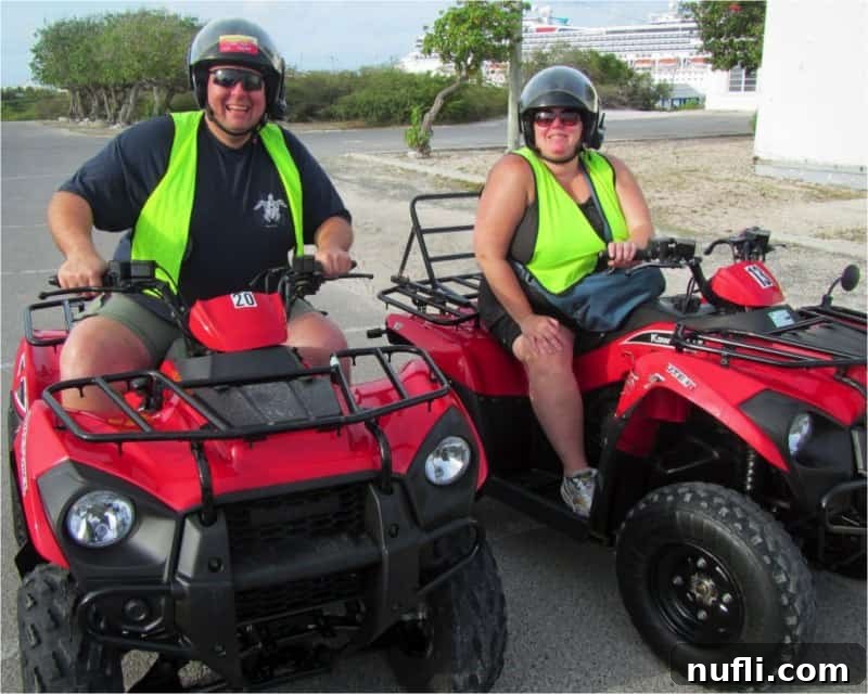 A couple smiling while riding ATVs on a scenic tour around Grand Turk island.