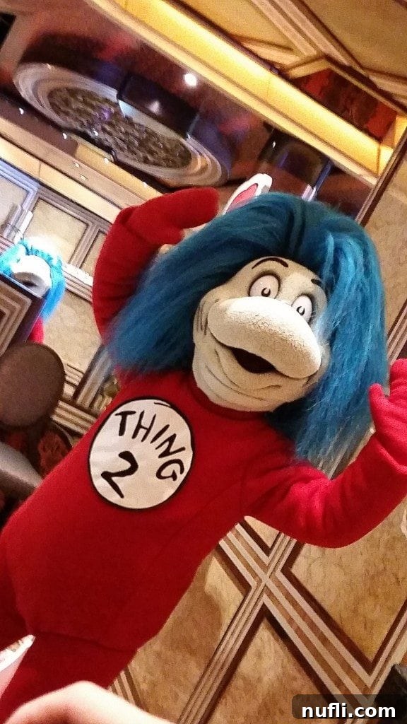 Thing 2 from Dr. Seuss character interacting with guests on Carnival Freedom