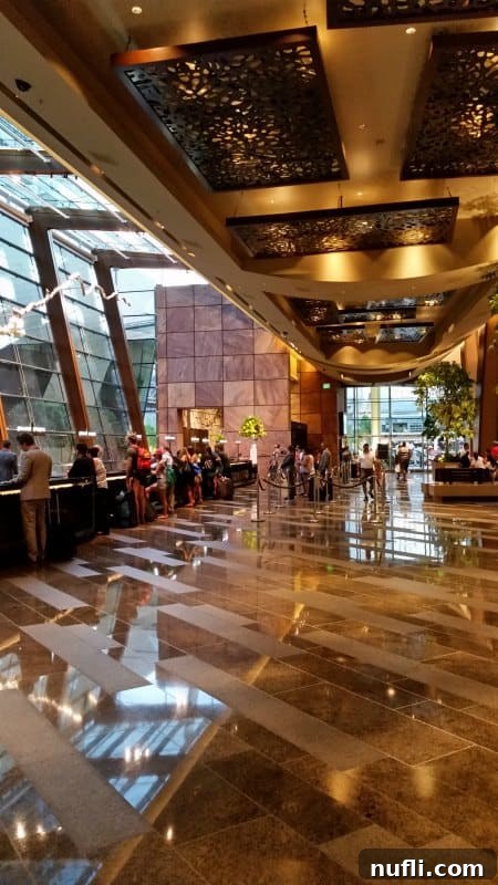 Aria check in area with people at the counter