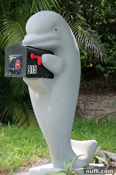 A beautifully crafted mailbox holder featuring a gentle manatee, symbolizing the abundant marine life and conservation efforts on Sanibel Island.