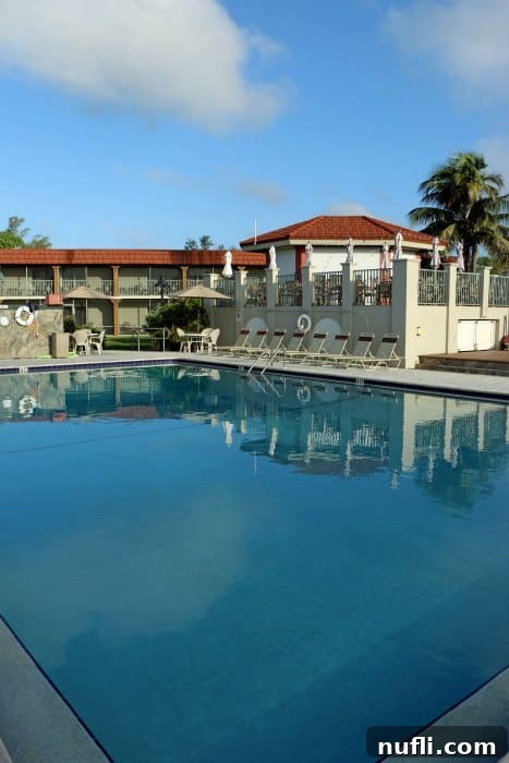 West Wind Inn Sanibel Island Permanently Closed 4 Pool area with hotel behind it