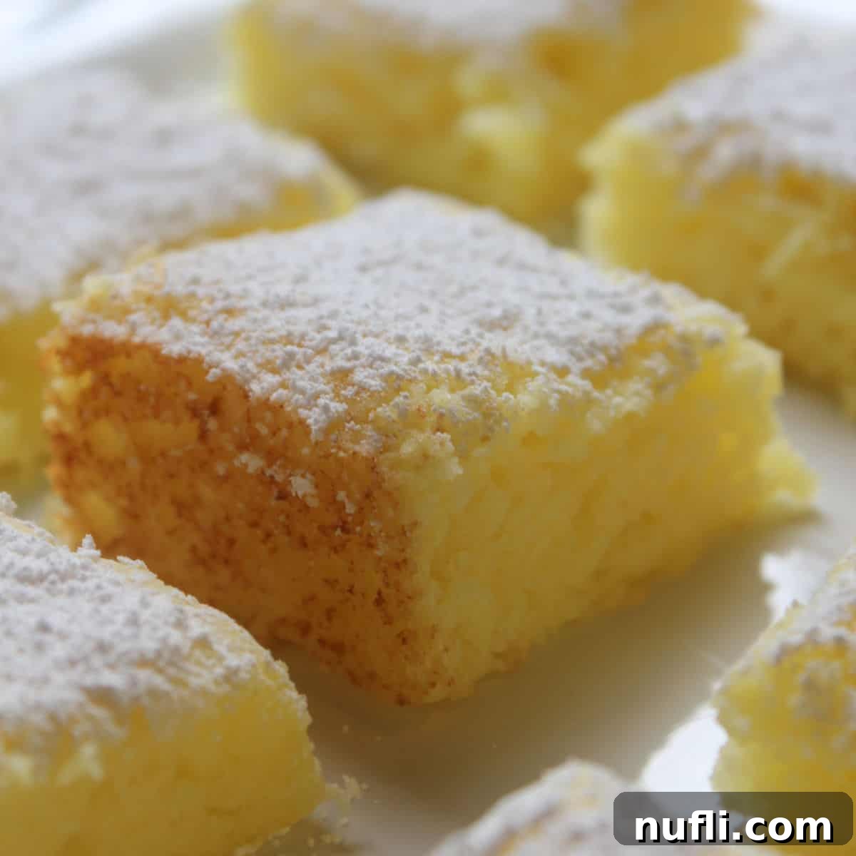 2 Ingredient Lemon Bars with powdered sugar garnish