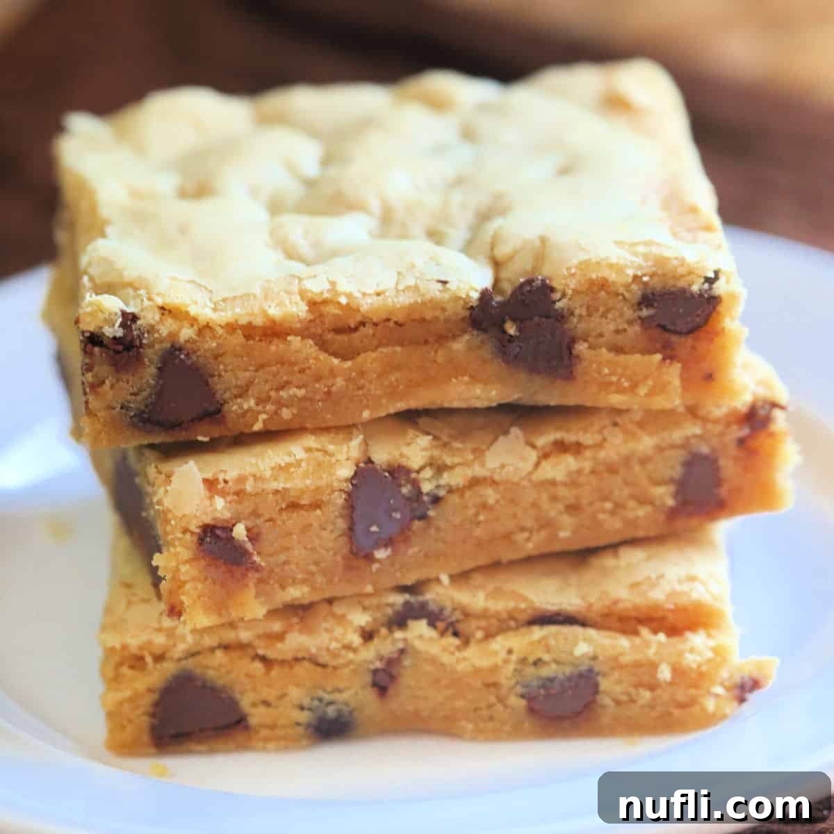 Chocolate Peanut Butter Cake Mix Cookie Bars stacked on a white plate