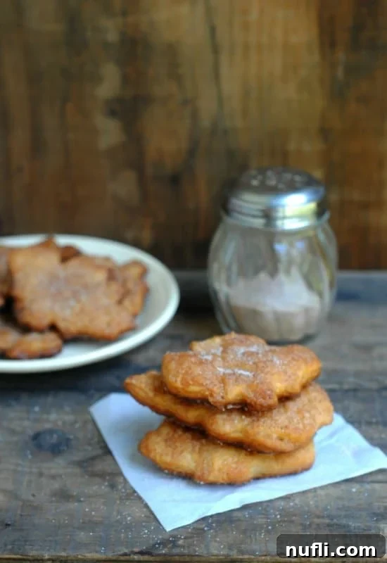 Cinnamon sugar coated puff pastry stacked on a napkin, golden brown and irresistible.