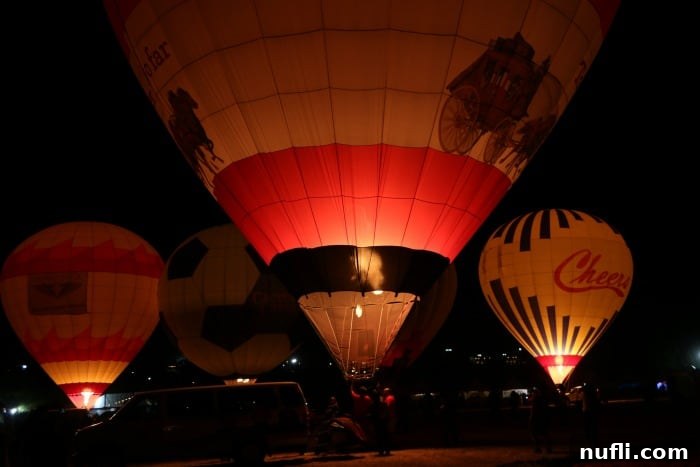 Hot airballoons lighting up in the dark 