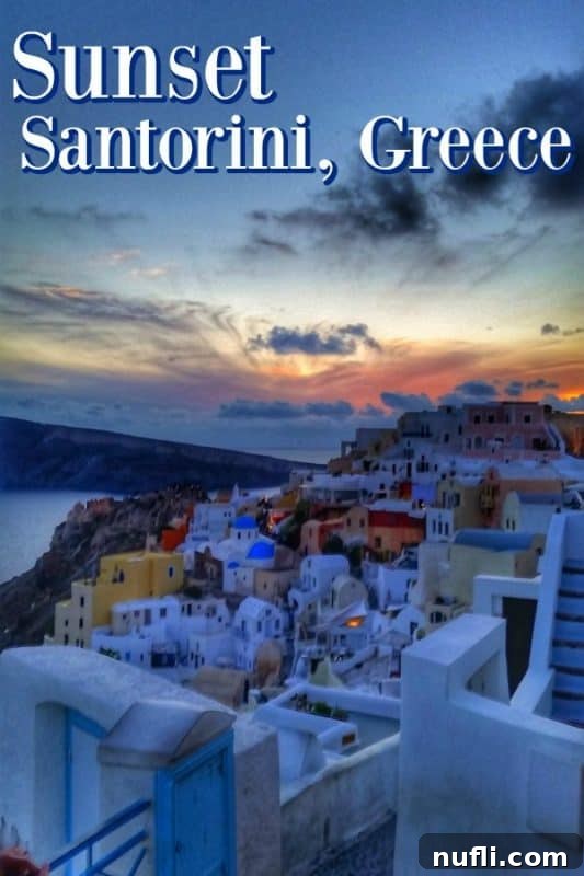 A stunning sunset over the iconic blue-domed and white-washed buildings of Oia, Santorini, Greece, with the Aegean Sea stretching into the horizon.