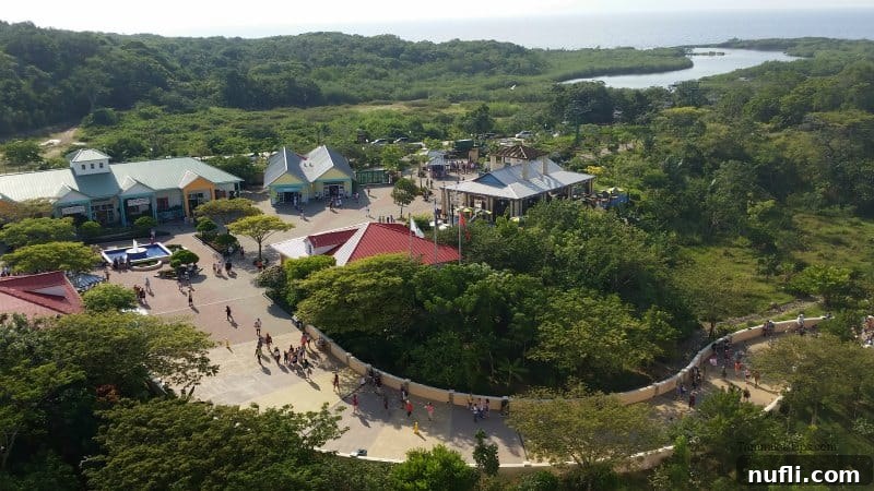 Mahogany Bay Roatan Cruise Adventure 5 looking down on buildings and tropical plants with people walking a long pathway