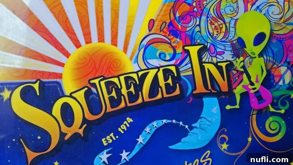 squeeze-inn sign with a green alien