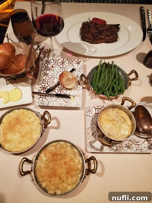 steakhouse dinner with steak, green beans, mac and cheese and potatoes