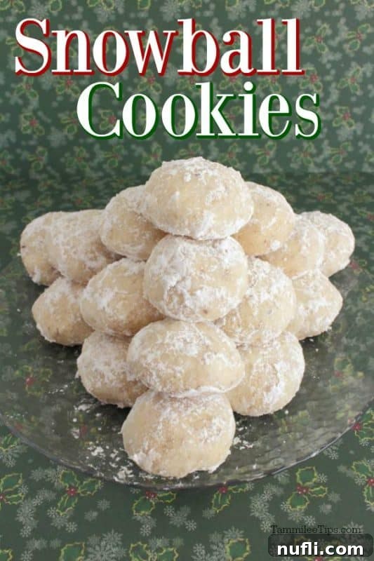 Snowball Cookies elegantly displayed on a glass plate, stacked for a festive look