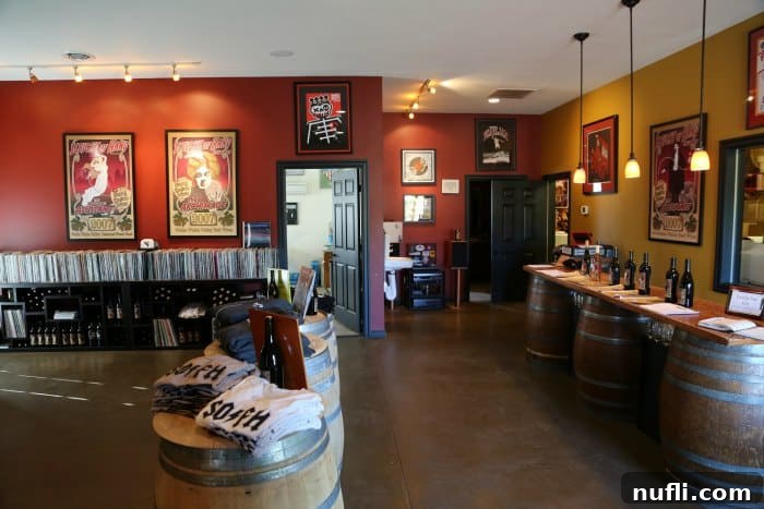 Sleight of Hand winery interior with large posters, wine barrels and bottles on display